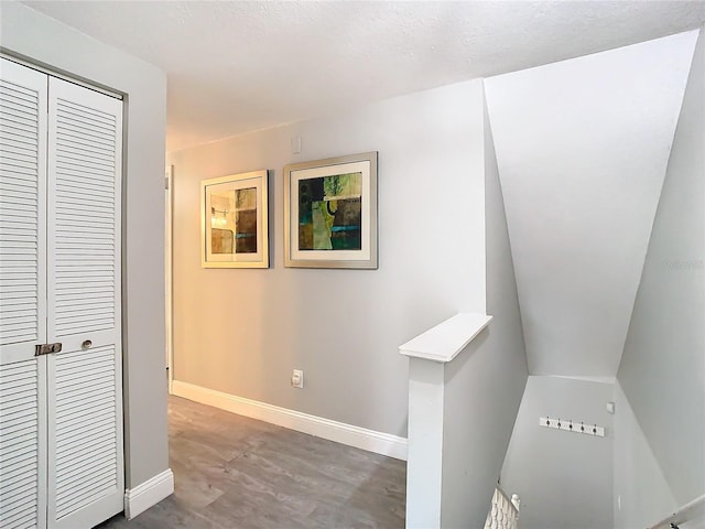 hallway with a textured ceiling