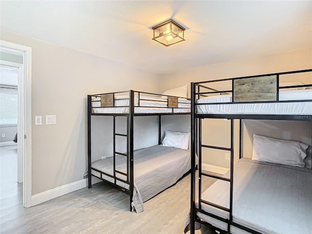 unfurnished bedroom with hardwood / wood-style floors