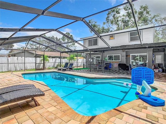 view of pool with a lanai and a patio area