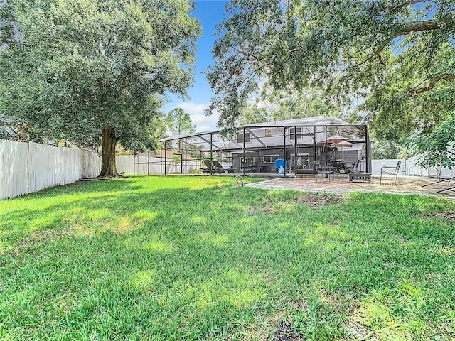 view of yard with glass enclosure