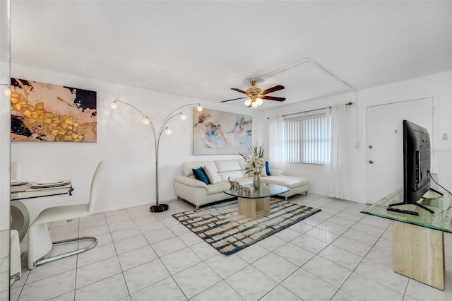 living room with light tile patterned floors and ceiling fan