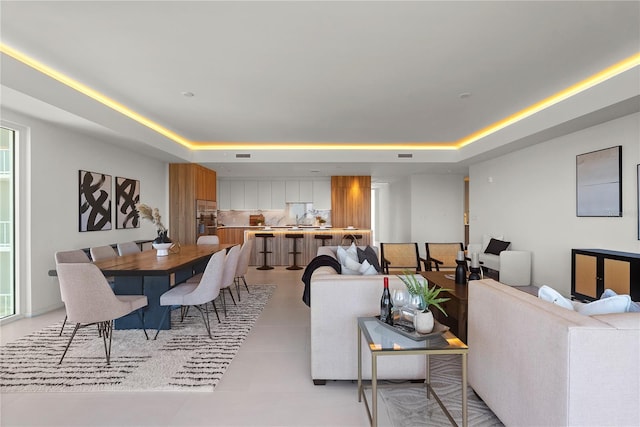 dining space featuring a tray ceiling