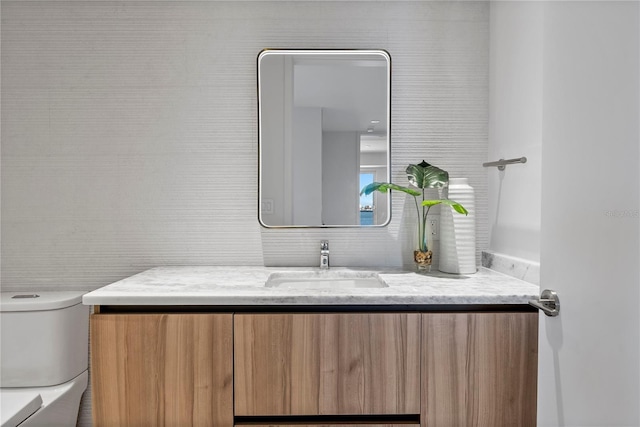 bathroom with vanity and toilet