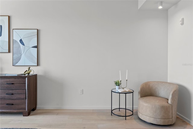 sitting room featuring light hardwood / wood-style floors