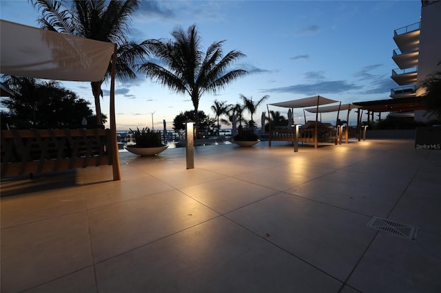 view of patio terrace at dusk