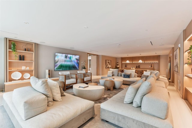 home theater room with light colored carpet