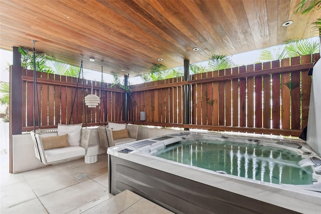 view of patio / terrace with a hot tub