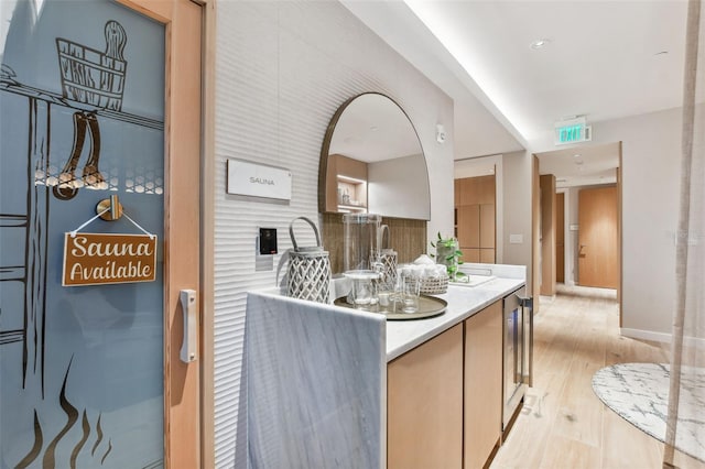 bathroom with vanity and hardwood / wood-style floors