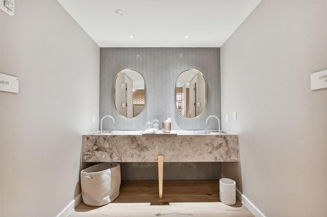 bathroom with wood-type flooring and vanity