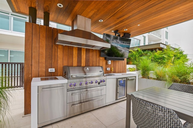 view of patio featuring exterior kitchen, a grill, and wine cooler