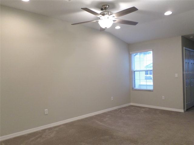 empty room featuring carpet, lofted ceiling, and ceiling fan