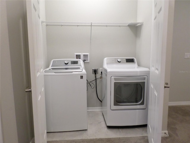 laundry area with washing machine and dryer