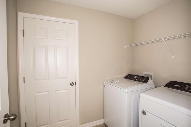 laundry area with washing machine and dryer