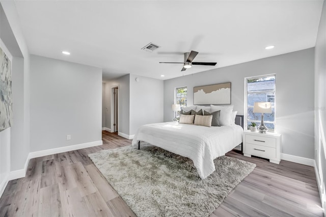 bedroom featuring ceiling fan and light hardwood / wood-style flooring