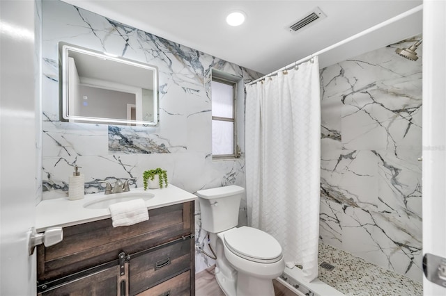 bathroom featuring vanity, backsplash, toilet, and walk in shower