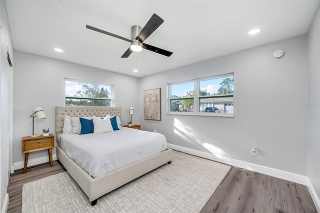 bedroom featuring ceiling fan and hardwood / wood-style floors