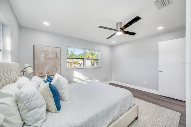 bedroom featuring ceiling fan and dark hardwood / wood-style flooring