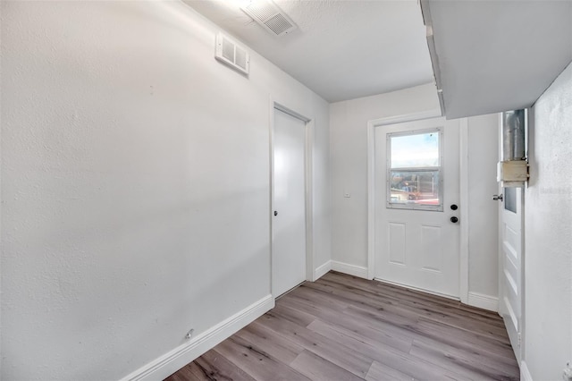 doorway with light hardwood / wood-style floors