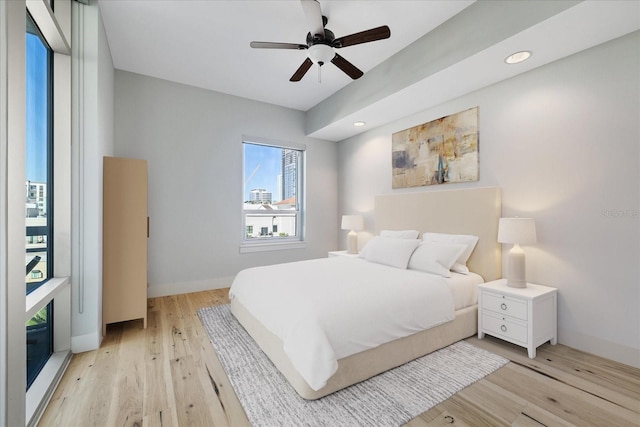 bedroom featuring light hardwood / wood-style flooring and ceiling fan