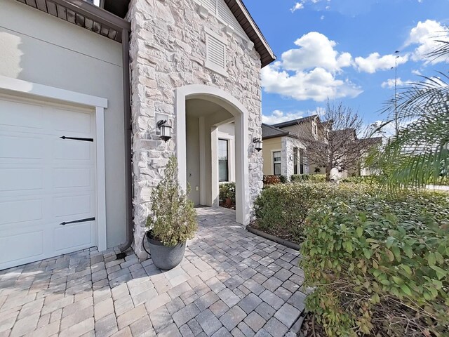 entrance to property featuring a garage