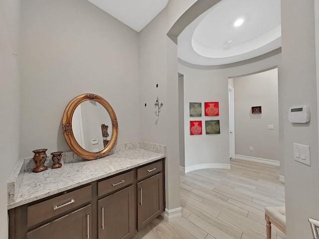 hallway with light hardwood / wood-style floors