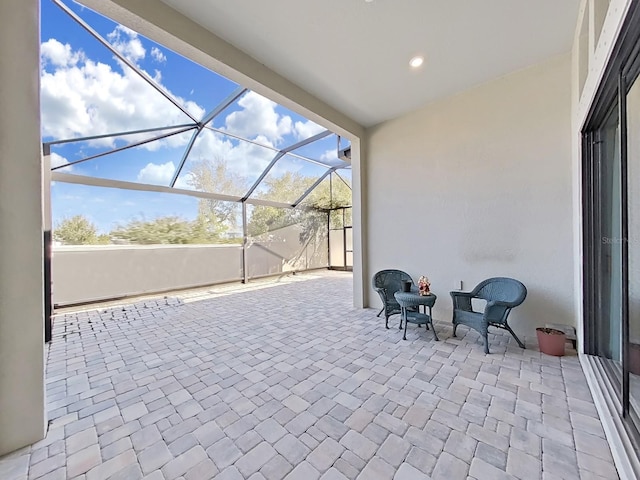 view of patio / terrace featuring a lanai