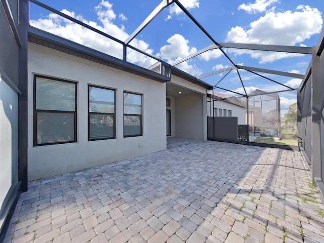 view of patio with a lanai