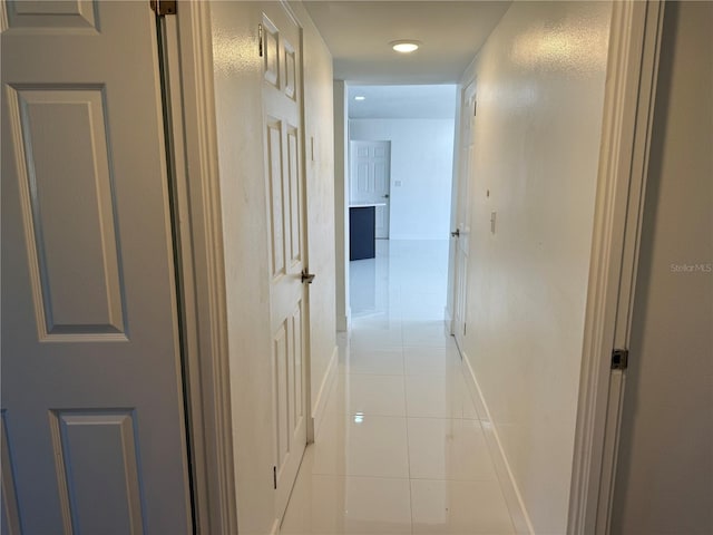 hallway with light tile patterned floors