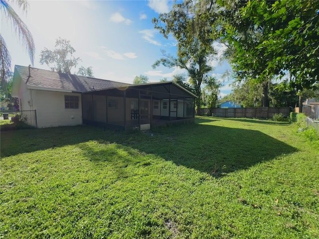 view of yard featuring a sunroom