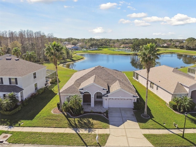 drone / aerial view with a water view