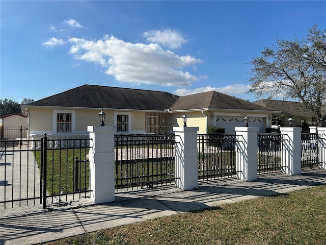 single story home with a garage and a front yard