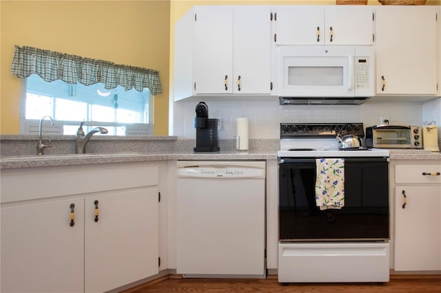 kitchen featuring backsplash, white cabinets, white appliances, and light hardwood / wood-style flooring