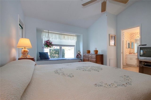 bedroom with ensuite bathroom, lofted ceiling, and ceiling fan