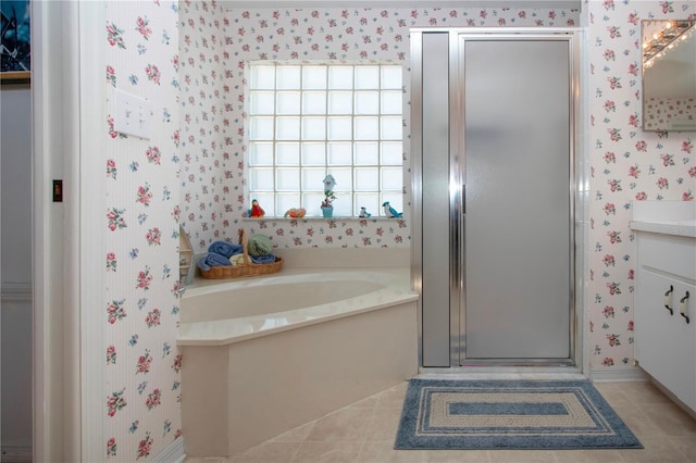 bathroom with vanity, plus walk in shower, and tile patterned flooring