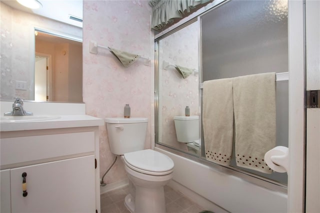 full bathroom with vanity, shower / bath combination with glass door, and toilet