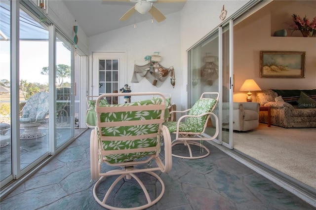 sunroom / solarium featuring ceiling fan and vaulted ceiling