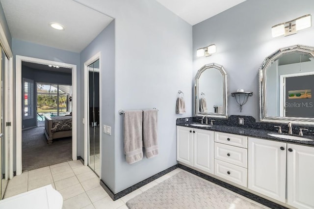 bathroom with tile patterned flooring and vanity