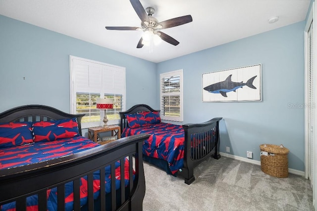 carpeted bedroom with ceiling fan