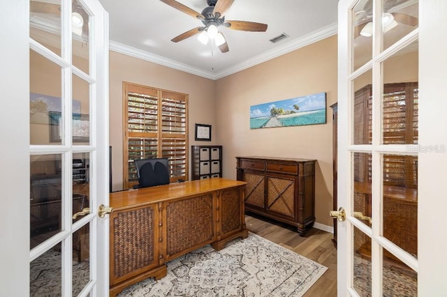 home office with wood-type flooring, ornamental molding, french doors, and ceiling fan