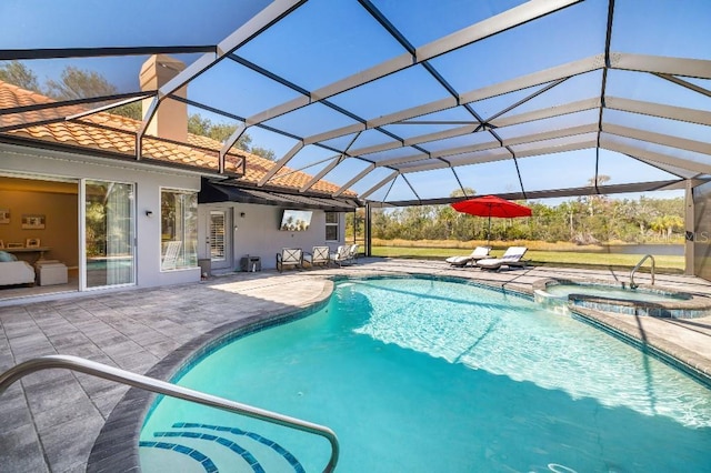 view of swimming pool featuring an in ground hot tub, a patio, and glass enclosure