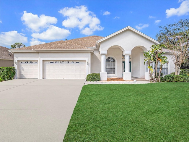 ranch-style home with a garage and a front yard