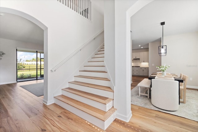 stairs with hardwood / wood-style floors