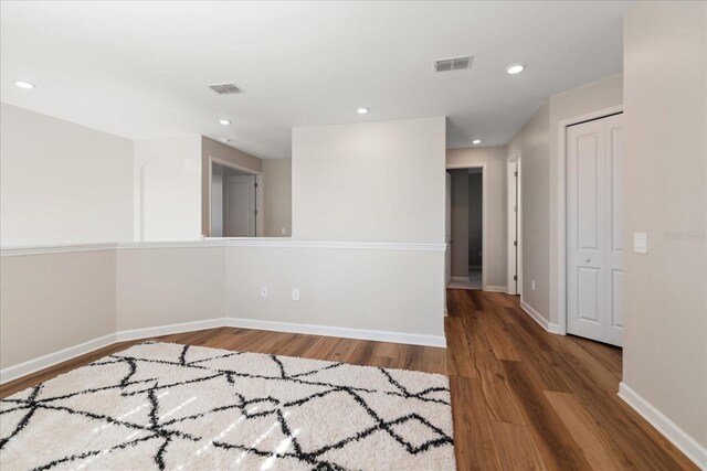 spare room with hardwood / wood-style flooring