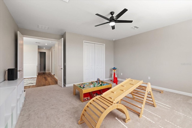 game room featuring ceiling fan and carpet