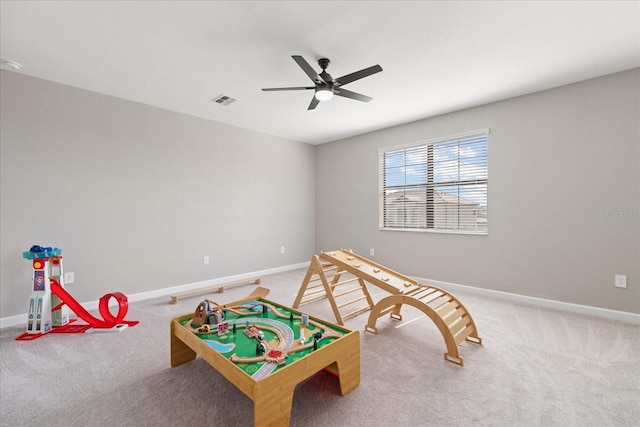 game room featuring carpet floors and ceiling fan