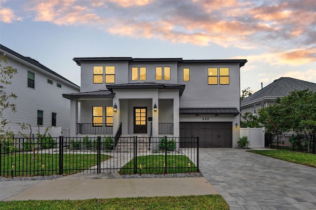 view of front of home with a garage and covered porch