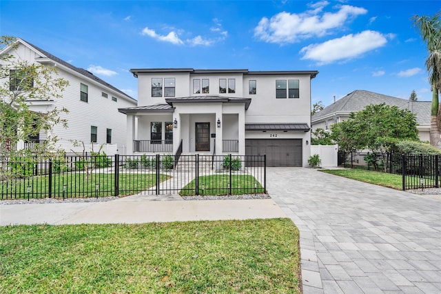 front of property featuring a garage, a porch, and a front lawn