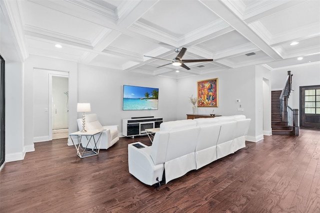 living room featuring dark hardwood / wood-style flooring, ornamental molding, coffered ceiling, ceiling fan, and beam ceiling