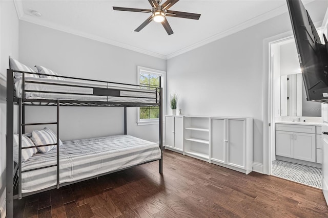 bedroom featuring ornamental molding, dark hardwood / wood-style flooring, ensuite bathroom, and sink