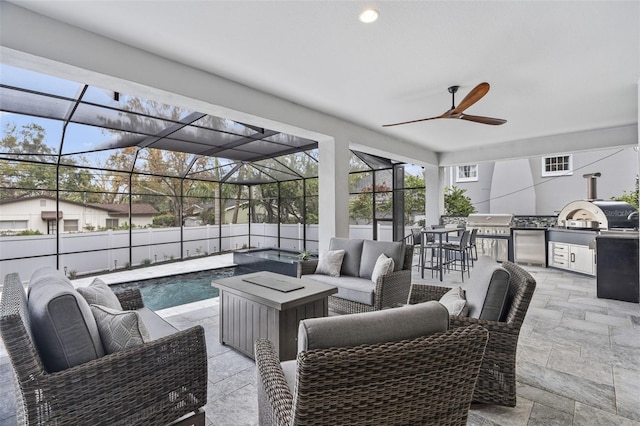 view of patio featuring a fenced in pool, an outdoor kitchen, a grill, a lanai, and an outdoor living space